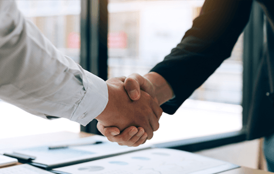 two people shaking hands on deal